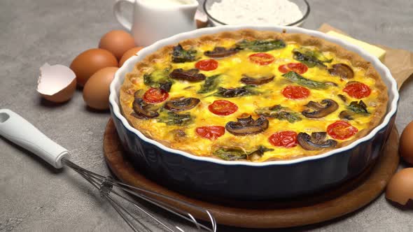 Baked Homemade Quiche Pie in Ceramic Baking Form Eggs and Cream