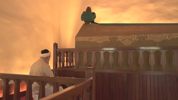 Muslim Old Man is Praying in Tomb