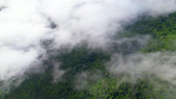 An aerial view from a drone flying over the many fogs in the mountains