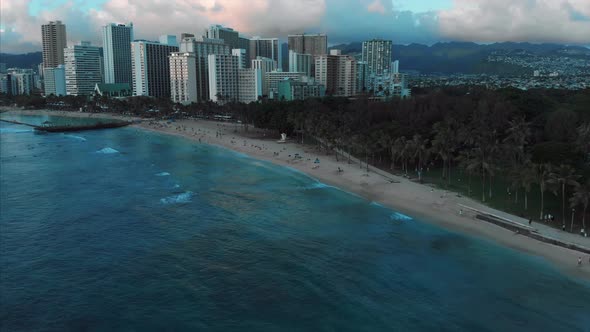 Aerial drone footage of Honolulu, Hawaii. Beautiful real estate, buildings in the city. Palm trees