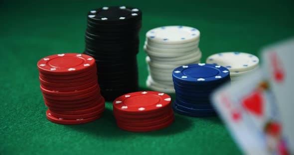 Playing cards and casino chips on poker table 4k