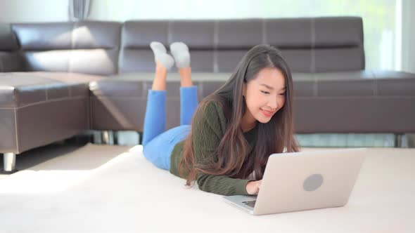 Young asian woman use laptop