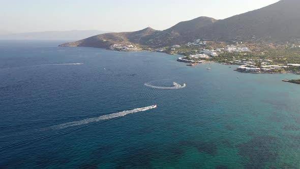Aerial View of a Motor Boat Towing a Water Skier. Elounda, Crete, Greece