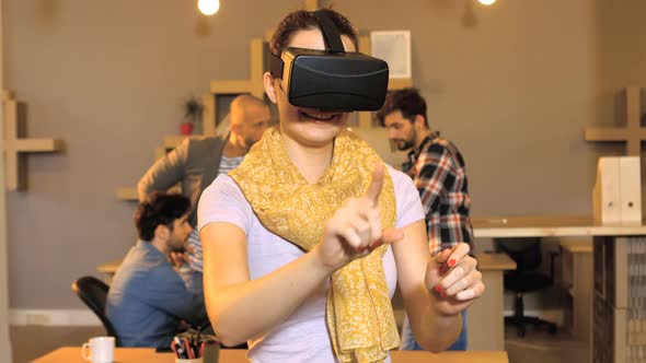 Female business executive using virtual glasses