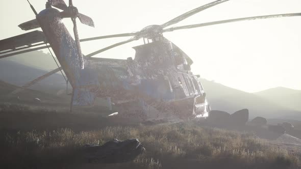 Old Rusted Military Helicopter in the Desert at Sunset