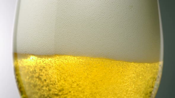 Extreme close-up beer bubbles in a glass, Slow Motion