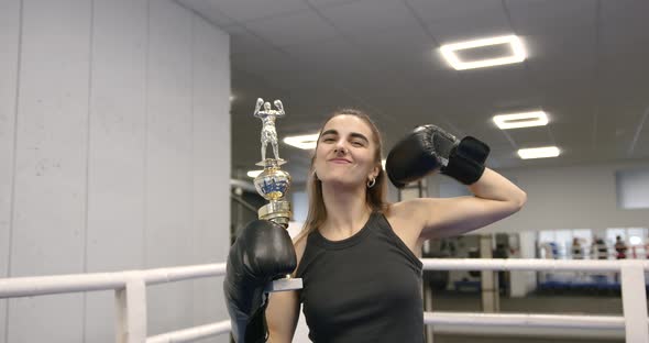 Girl Boxing in the Arena in a Modern Bright Gym