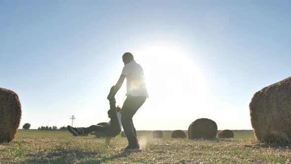 Joyful Father Circling Daughter Over Wheat Field