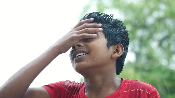 Teenage Boy Under Rain Outdoor