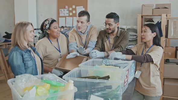 Portrait of Volunteers during Garbage Sorting Indoors