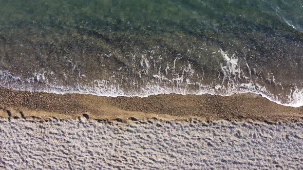 Aerial View From Above on Azure Sea and Pebbles Beach