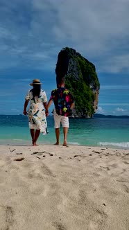 Koh Poda Krabi Thailand Asian Woman and European Men Walking on the Tropical Beach of Koh Poda
