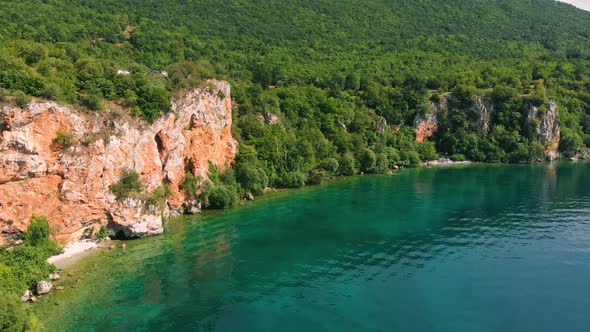 Aerial shot of Macedonia coast. Clif and beautiful water around Ohrid Lake in Southern Europe.