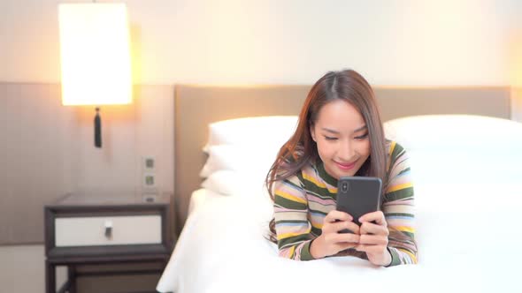 Young asian woman use smart phone