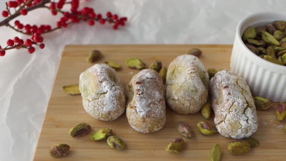 Closeup shot of a setup for food photography, chewy pistachio amaretti Christmas cookies