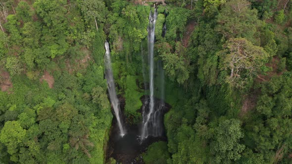 Drone Over Sekumpul Waterfalls Flowing Into Forest