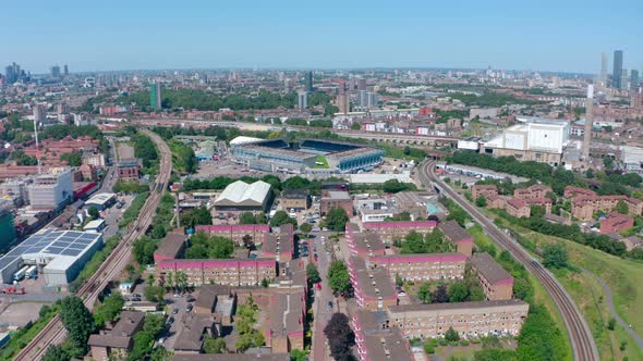 Dolly forward rising drone shot of Millwall FC stadium Bermondsy South London