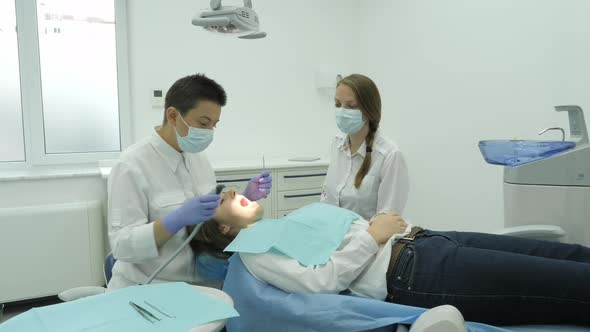 Dentist performing a dental check