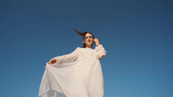 Beautiful Pretty Pretty Woman in White Wedding Dress Spin in Front of Camera and Flirting