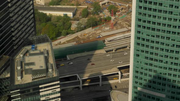 Panorama of the Bridge Road with Cars Traffic with a View of the Skyscraper