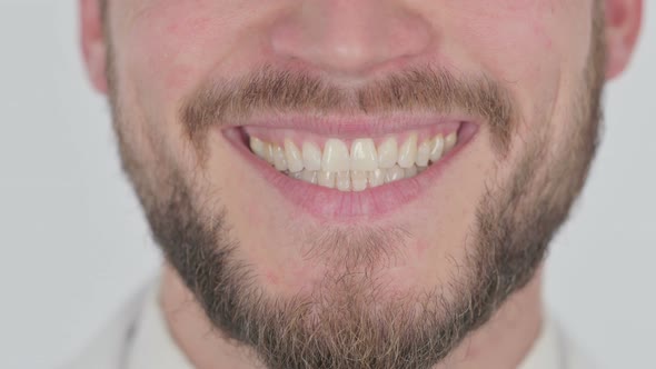 Smiling Lips of Young Man on White Background