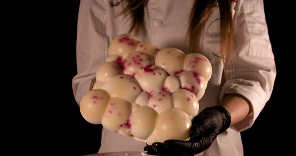 Woman Chef Shows the Cake with Jam Stains