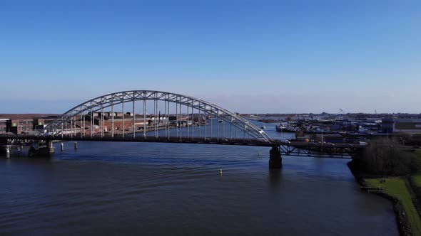 Arch Bridge Over Noord River With A View Of Hendrik-Ido-Ambacht Town In South Holland, Netherlands.