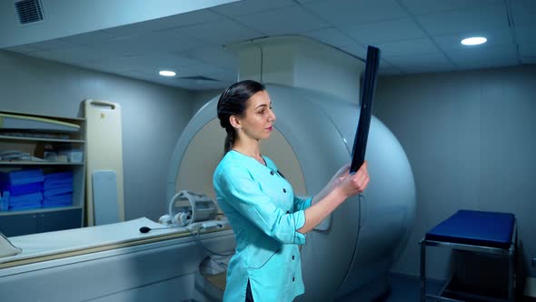 Female radiologist with x-ray photo