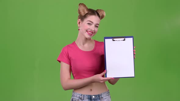 Teenager Advertises a Tablet for Paper. Green Screen. Slow Motion