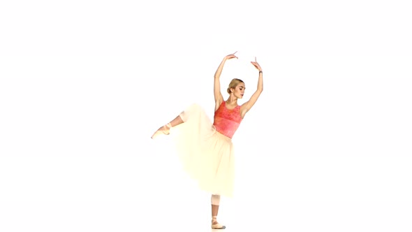 Young Ballerina Making Dance Trick, Grands Battements, on White Background