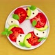 Caprese salad with tomatoes, mozzarella cheese, basil and avocado in plate - Stop Motion Animation - VideoHive Item for Sale