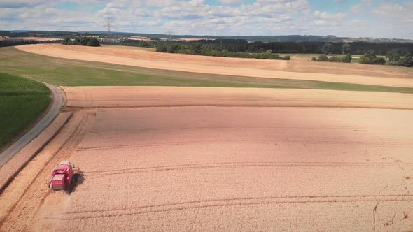 Agricultural machine working in farmland during harvesting. Farming concept