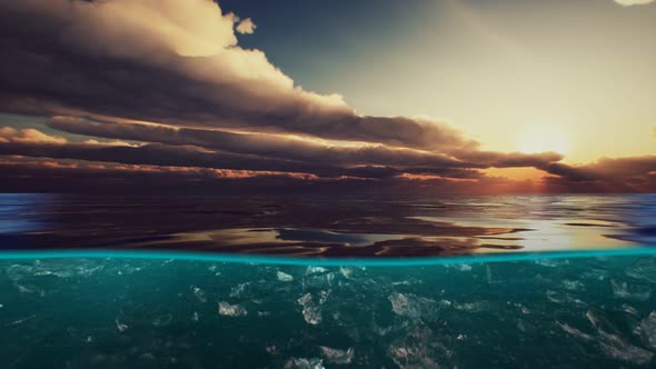 Split View Over and Under Water in the Caribbean Sea with Clouds