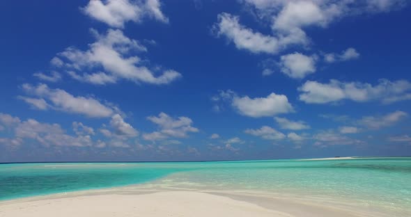 Luxury fly over copy space shot of a white paradise beach and blue ocean background in high resoluti