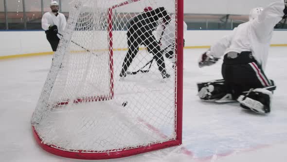 Scoring Goal Into Net During Hockey Game