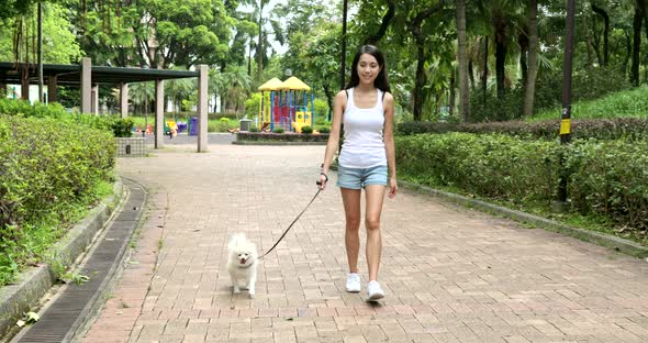 Woman walking with her dog