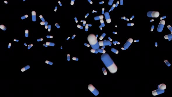 Blue-white medicines falling down pills, antibiotics, vitamins