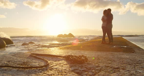 Couple embracing each other on the beach 4k