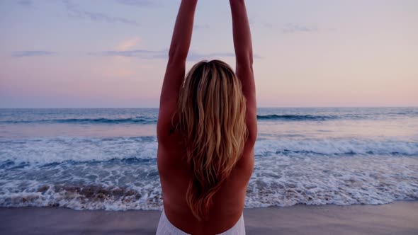 Attractive Woman Enjoying The Beach At Sunset