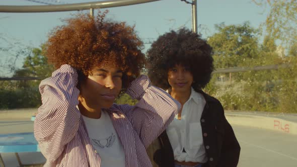 Portrait of Two Mixed Race Black Women in the Park at Sunrise