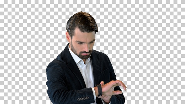 Businessman using digital watch while standing, Alpha Channel