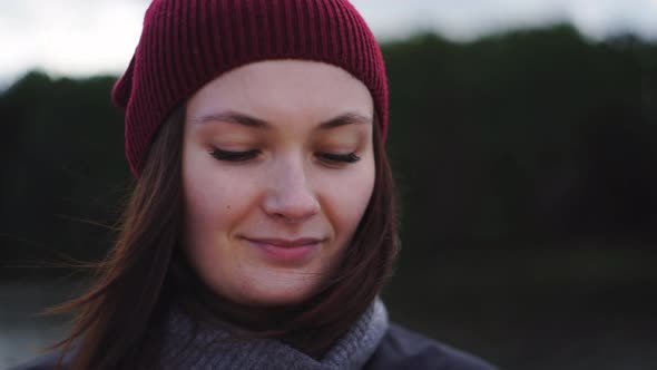 Woman Stands in Nature Drinks Warm Tea From Thermo Mug