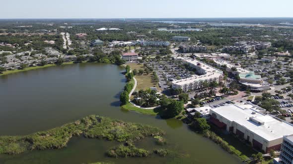 distant aerial of large lakes and wetlands by the Lakewood Ranch Mainstreet shopping district, Brade