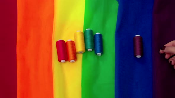 Multicolored Pieces of Fabric and a Threads on the Table Preparation for the Ride Parade Lgbt