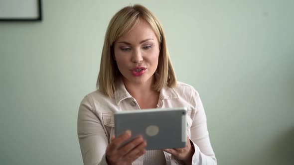 Woman Is Talking By Video Call on Tablet, Introducing Herself for Job Interview