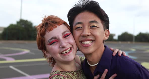 Young diverse friends having fun outdoor laughing together