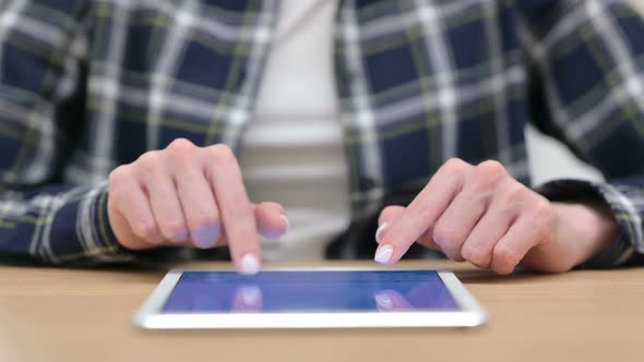 Female Hands Typing on Tablet Close Up