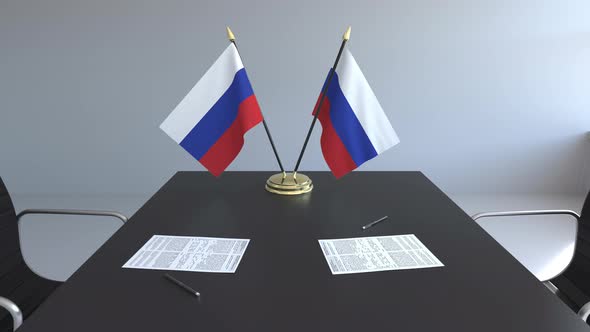 Flags of Russia and Papers on the Table