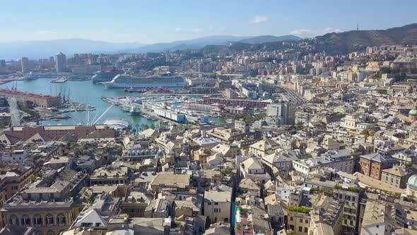 Aerial panoramic drone view of buildings and streets surrounding Port of Genoa,Italy. HD video