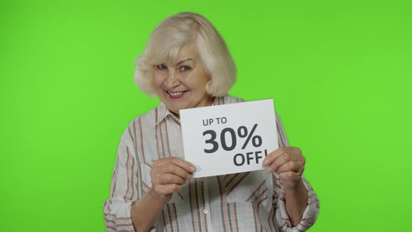 Senior Grandmother Showing Up To 30 Percent Off Inscription Signs, Rejoicing Discounts. Black Friday
